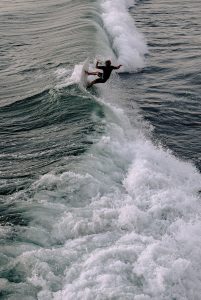 Photo Of Person Surfing On The Sea