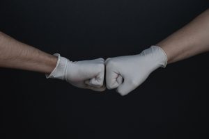 person wearing white long sleeve shirt and white gloves