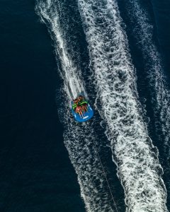a jet ski being pulled by a boat in the ocean