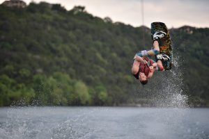 person on wakeboard flipping